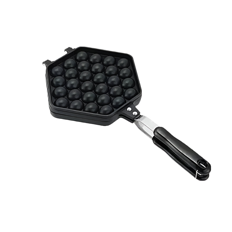 Black waffle ball maker with a handle on a white background